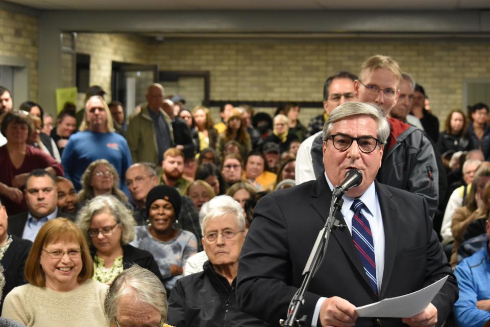 James Masters, a South Bend attorney who owns a home on the city's northwest side, speaks in opposition to a low-barrier homeless shelter during a packed public meeting on Feb. 1, 2024, at The Beacon Resource Center on Lincoln Way West.