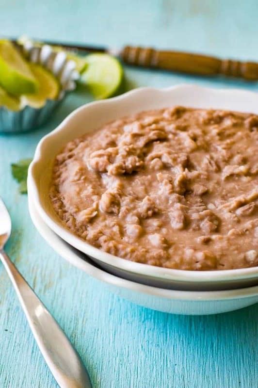 <p>House of Yumm</p><p>This classic side can be made with dried beans or canned beans and it's super easy and delicious either way. Get this <a href="https://houseofyumm.com/homemade-refried-beans/" rel="nofollow noopener" target="_blank" data-ylk="slk:Homemade Refried Beans;elm:context_link;itc:0;sec:content-canvas" class="link rapid-noclick-resp">Homemade Refried Beans</a> recipe!</p>