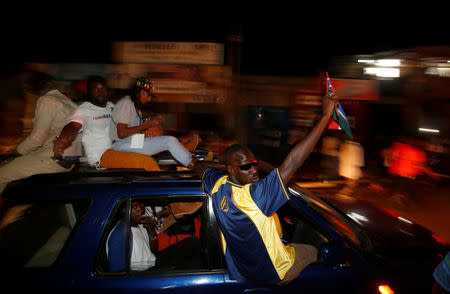 People celebrate the arrival of Gambia's new President Adama Barrow to the country, at the airport in Serekunda, Gambia January 26, 2017. REUTERS/Thierry Gouegnon