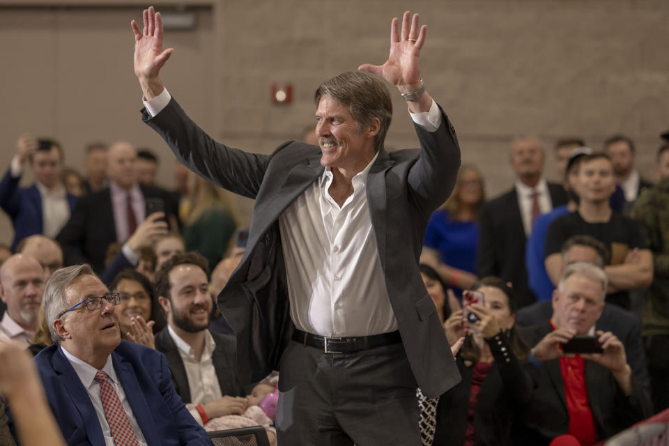 Madison, Wis businessman and Republican U.S. Senate candidate, Eric Hovde stands up after being acknowledged, Tuesday April 2, 2024, at a former President Donald Trump rally in Green Bay, Wis. The Wisconsin Senate race between Democratic Sen. Tammy Baldwin and Republican Eric Hovde is setting up as one of the most competitive and expensive Senate races in the country. (AP Photo/Mike Roemer)