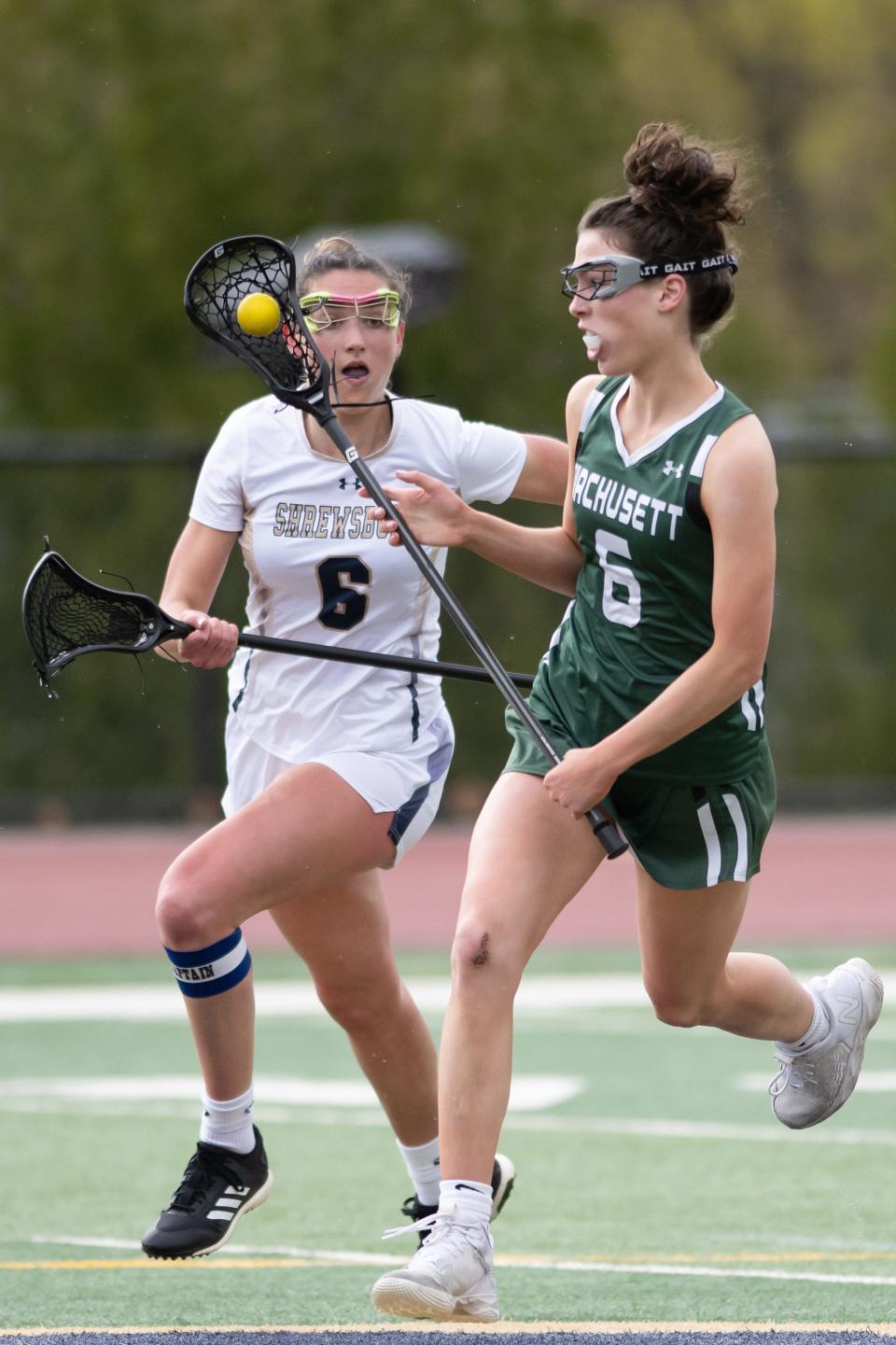 Wachusett's Rileigh Leary runs ahead of Shrewsbury's Maddie Mrva.