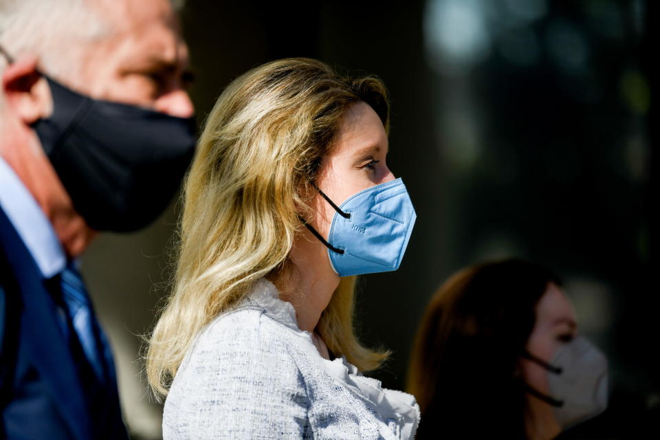 Theranos founder Elizabeth Holmes exits Robert F. Peckham U.S. Courthouse with her attorneys after the first day of federal court hearings, in San Jose, California, U.S. May 4, 2021.  REUTERS/Kate Munsch