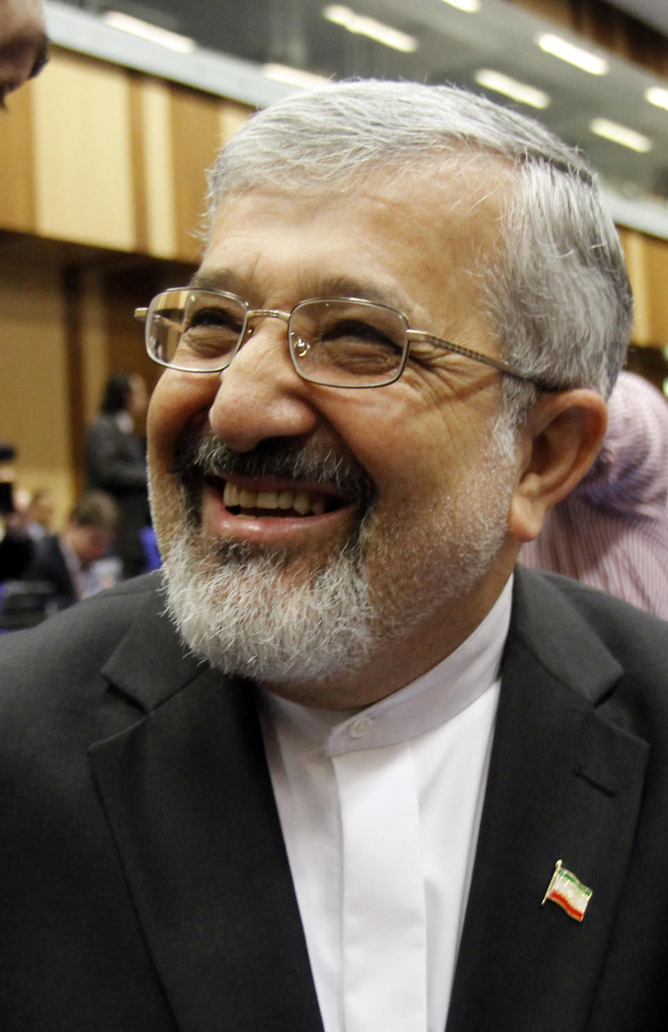 Iran's ambassador to the International Atomic Energy Agency, IAEA, Ali Asghar Soltanieh laughs prior to the start of the IAEA board of governors meeting at the International Center, in Vienna, Austria, on Thursday, March 8, 2012. (AP Photo/Ronald Zak)