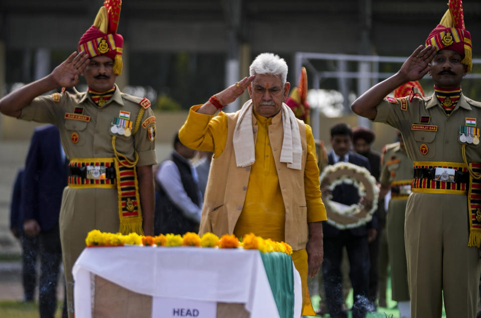 Jammu and Kashmir Lieutenant Governor Manoj Sinha, pays tribute to Indian Border Security Force (BSF) soldier Lal Fam Kima during a wreath-laying ceremony at the BSF headquarters in Jammu, India, Thursday, Nov.9, 2023. The BSF soldier was killed as Indian and Pakistani soldiers exchanged gunfire and shelling along their highly militarized frontier in disputed Kashmir. (AP Photo/Channi Anand)