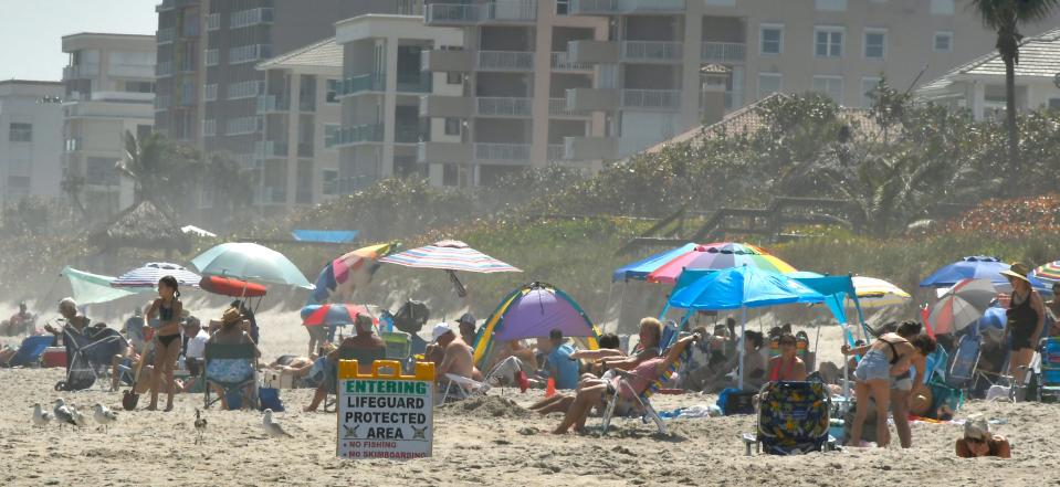 Beachgoers on a weekday at Paradise Beach on A1A, Melbourne.