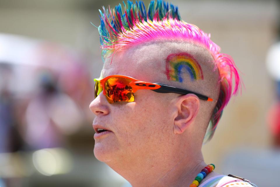 Many attendees of Round Rock Pride Festival on Saturday came in colorful grab, or in the case of Melissa Burroughs-Owen, rainbow-hued hair.