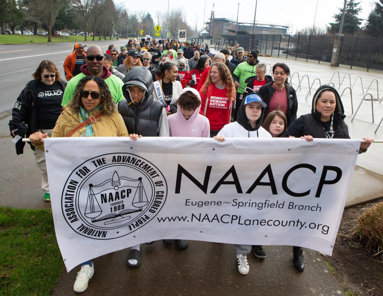 Marchers make their way along Dr. Martin Luther King Jr. Boulevard on Feb. 19 in Eugene in memory of King. The original march was canceled due to the ice storm last month.