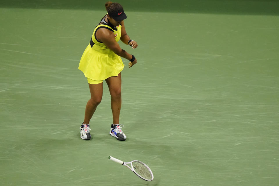 Naomi Osaka, of Japan, throws her racket down during a match against Leylah Fernandez, of Canada, at the third round of the US Open tennis championships, Friday, Sept. 3, 2021, in New York. (AP Photo/Frank Franklin II)