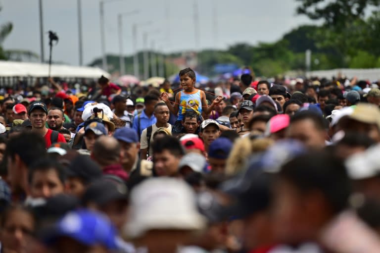 Honduran migrants heading in a caravan to the US gather at the Guatemala-Mexico border bridge in Ciudad Hidalgo, Chiapas state, Mexico, on October 19, 2018