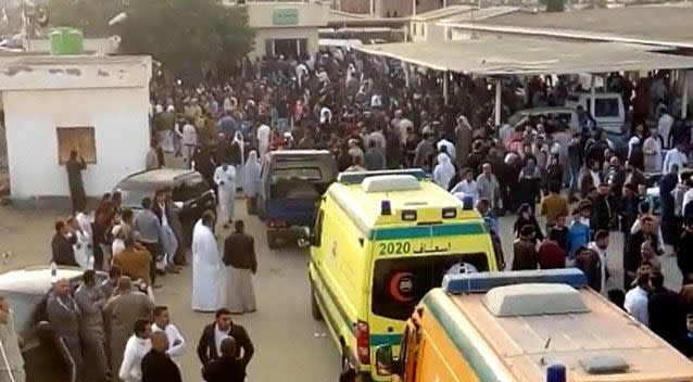 Relatives queuing up outside the hospital as ambulances raced back and forth. Photo: AP