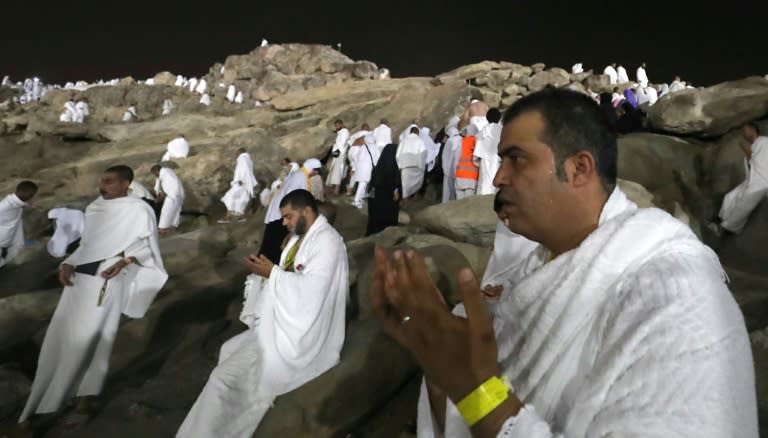 Muslim pilgrims walk and pray on Mount Arafat during the climax of the hajj pilgrimage in Saudi Arabia on August 30, 2017