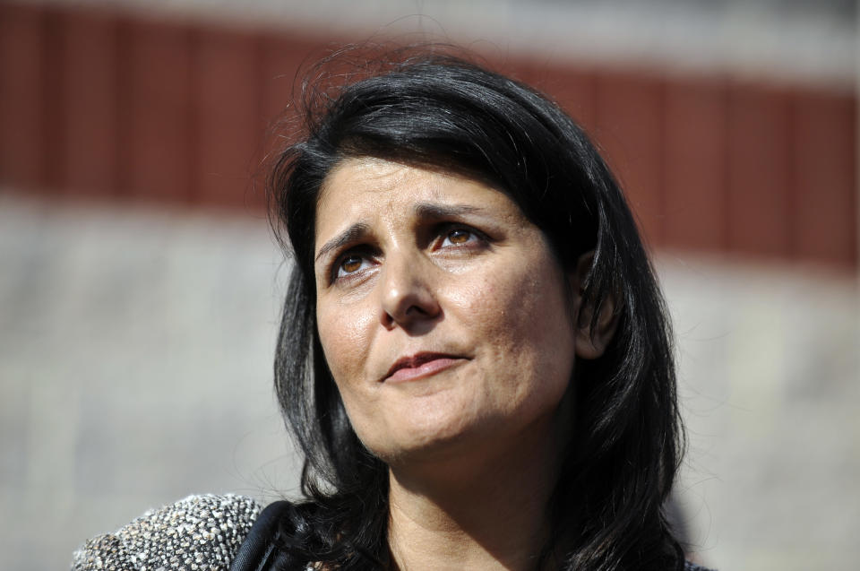 South Carolina Gov. Nikki Haley watches as her husband, Michael Haley boards a bus during a deployment ceremony for the South Carolina Army National Guard 3/49 Agribusiness Development Team at McCrady Training Center, Thursday, Jan. 10, 2013, at Ft. Jackson, S.C. The deployment is scheduled for a year including a one month of training in Indiana prior to leaving for Afghanistan. (AP Photo/Rainier Ehrhardt)