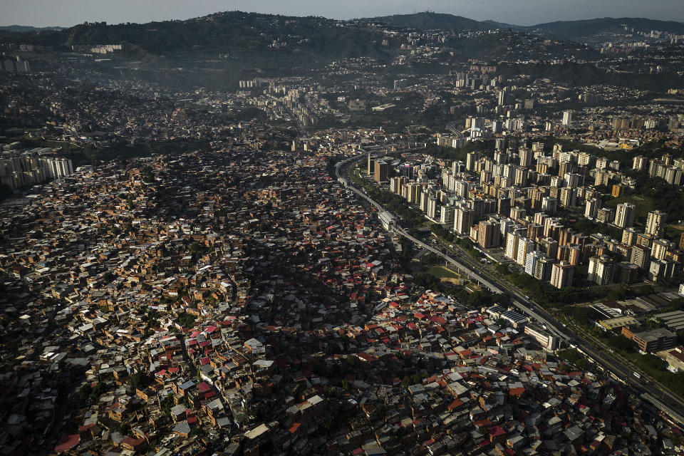 FILE - Homes cover a hill in the Petare neighborhood of Caracas, Venezuela, Monday, Oct. 2, 2023. (AP Photo/Matias Delacroix, File)