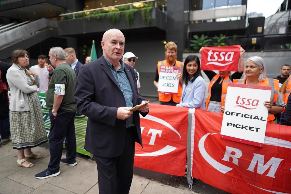 Mick Lynch outside Euston Station on Thursday (PA)