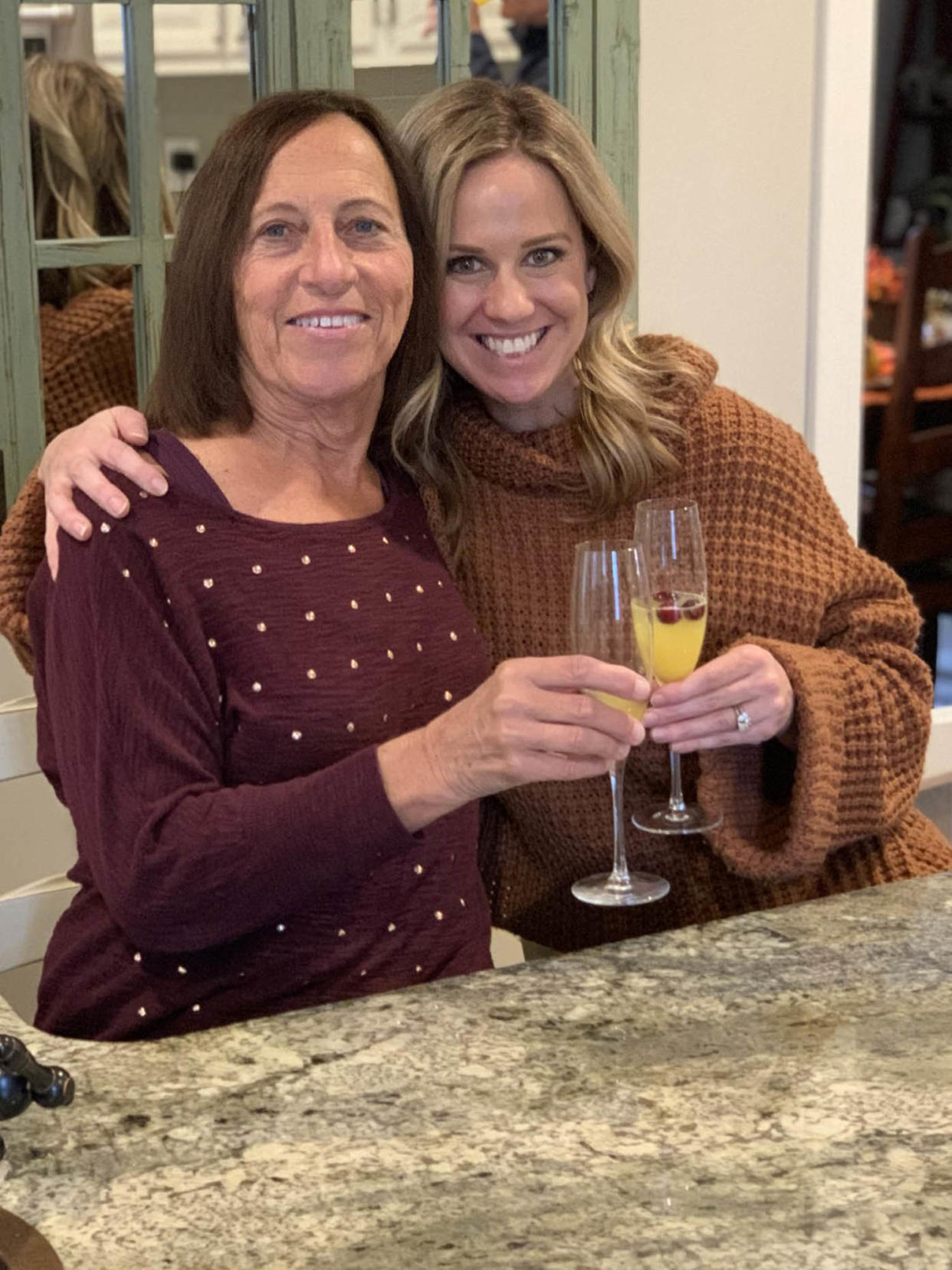 Carol Rosen (left) and her daughter, Lindsay Murray, celebrate Thanksgiving in 2020. Rosen, a 70-year-old retired schoolteacher, passed her final days in anguish, after three weeks of chemotherapy with incompatible drugs.  (Justin Murray / KFF Health News)