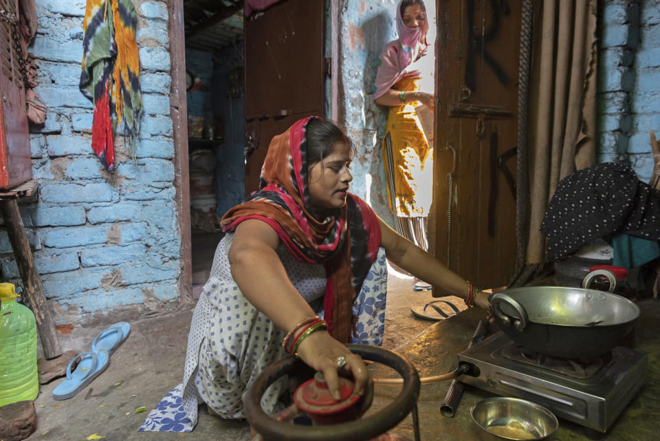 Raj Kumari prepares a meal at her home in New Delhi. (Saumya Khandelwal for NBC News)