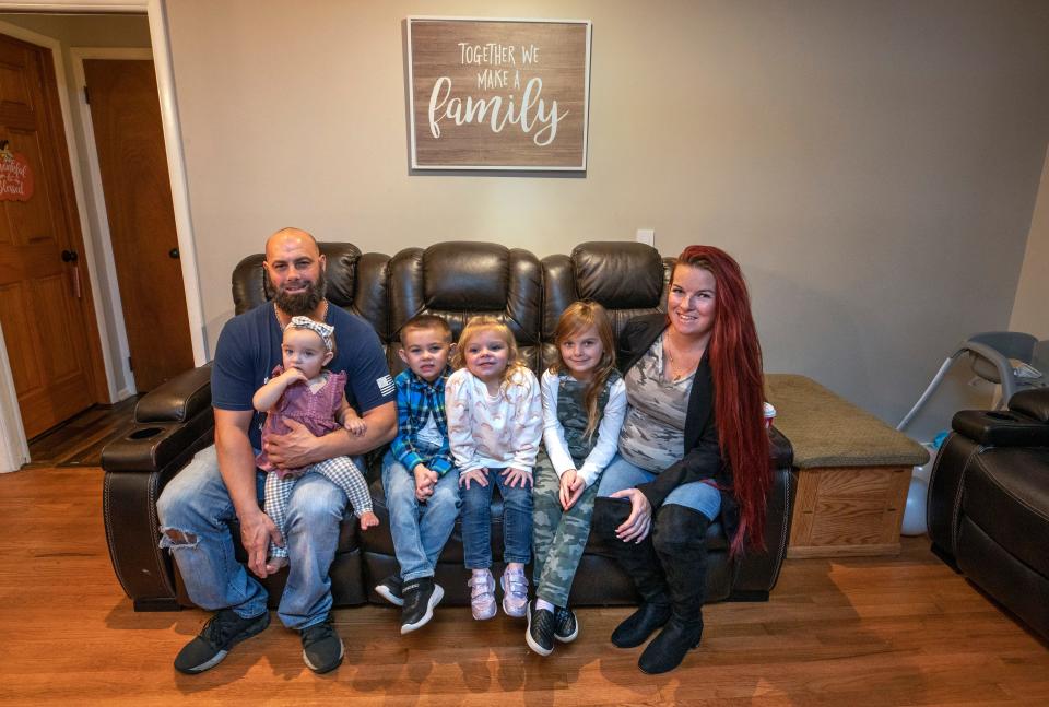 Left to right: Al Torrisi (father), with Berkeley (1) on his lap, E.J. (5), Cecelia (3), Saige, (6) and Emily Torrisi (mother)EJ, 5, is transgender and identifies as a boy. His mother Emily wants to get the word out about his acceptance in school and praise his school's handling of the situation. 