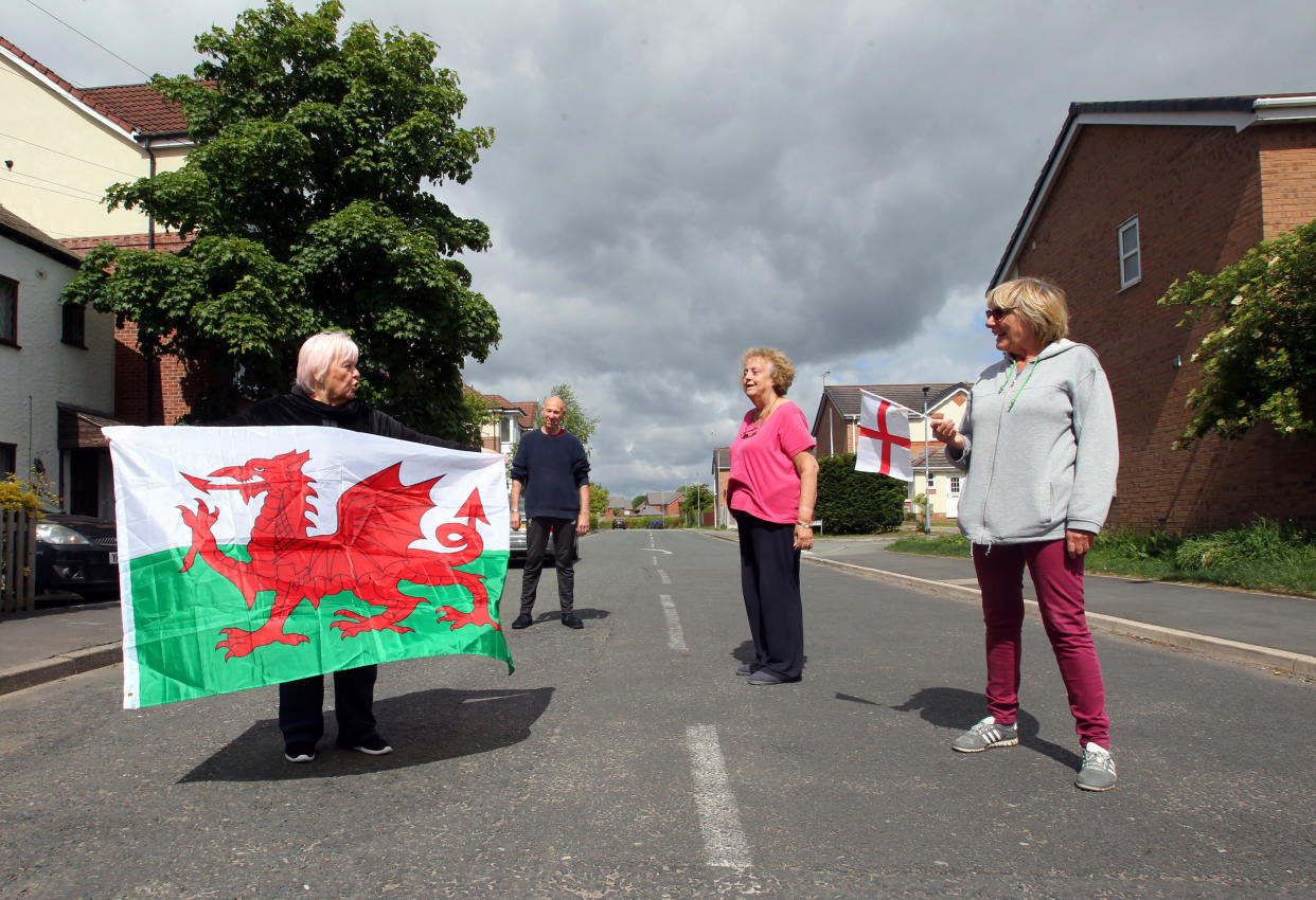 Cllr Veronica Gay and fellow Welsh resident Alan William Brumby (left) live on the same street as English residents Anne Amboorallee and Linda Astbury (right) but the road is the border between Flintshire in North Wales and Cheshire, England, which are subject to different lockdown restrictions. (Picture: Ian Cooper)