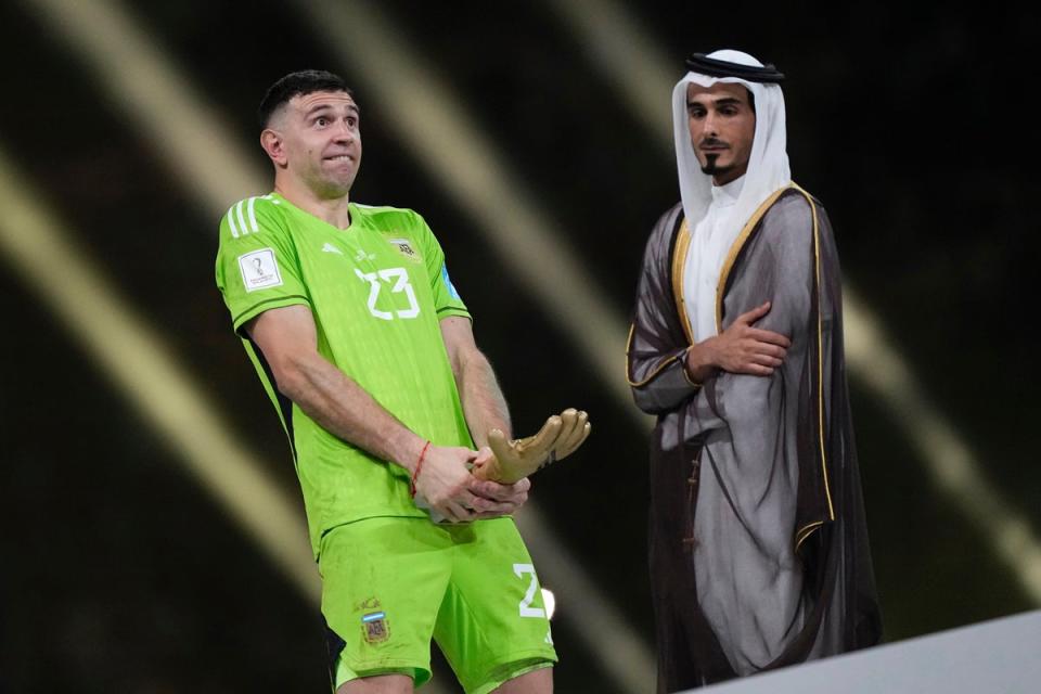 Emiliano Martinez caused a mild controversy with his lewd gesture after winning the Golden Glove award at the World Cup (AP)