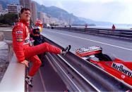 FILE PHOTO: Germany's Michael Schumacher poses next to his Ferrari during qualifying for the Monaco Grand Prix in Monte Carlo