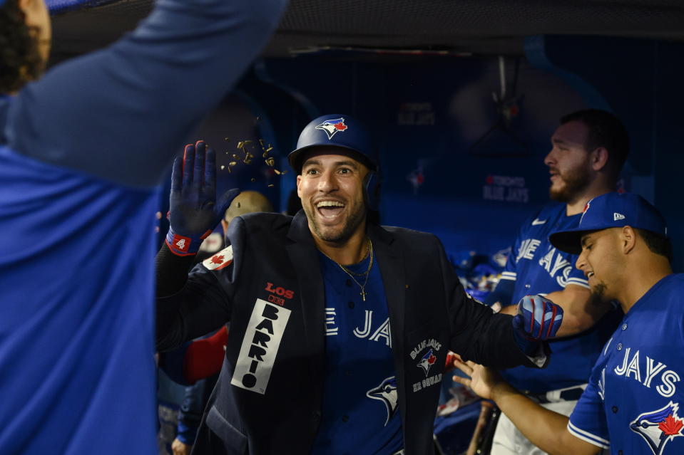 Toronto Blue Jays' George Springer celebrates with teammates after hitting a solo home run against the New York Yankees during the first inning of a baseball game Tuesday, Sept. 27, 2022, in Toronto. (Christopher Katsarov/The Canadian Press via AP)