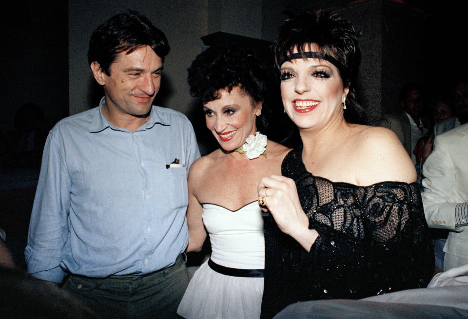 Entertainer Liza Minnelli, right, is shown with actress Chita Rivera, center and actor Robert De Niro, during a party Minnelli hosted to honor Rivera for winning the best actress Tony Award for "The Rink," June 9, 1984, in New York. Rivera, the dynamic dancer, singer and actress who garnered 10 Tony nominations, winning twice, in a long Broadway career that forged a path for Latina artists, died Tuesday. She was 91. (AP Photo, File)