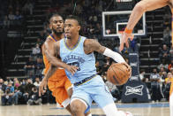 Phoenix' Chris Paul (3) defends Memphis' Ja Morant (12), in the first half of an NBA basketball game Friday, Nov. 12, 2021, in Memphis, Tenn. (AP Photo/Karen Pulfer Focht)