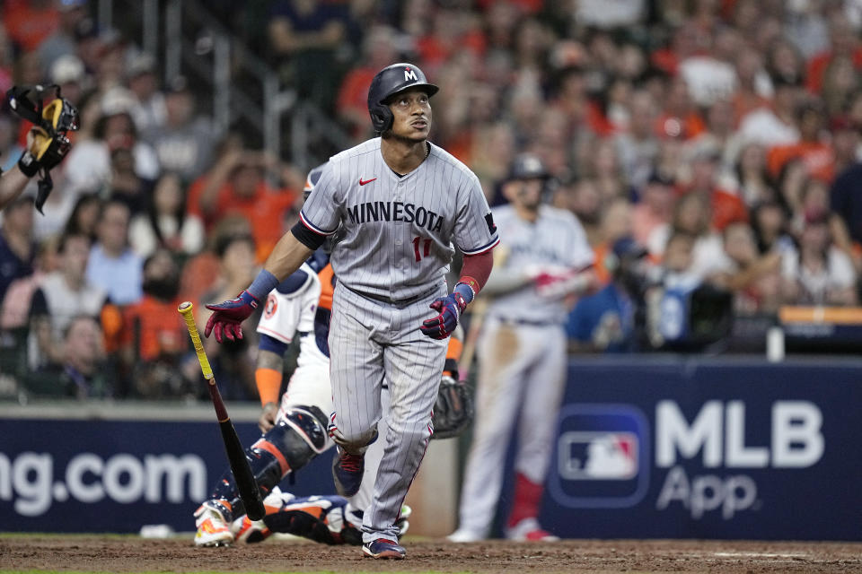 Minnesota Twins' Jorge Polanco watches his three-run home run during the seventh inning in Game 1 of an American League Division Series baseball game against the Houston Astros, Saturday, Oct. 7, 2023, in Houston. (AP Photo/Kevin M. Cox)