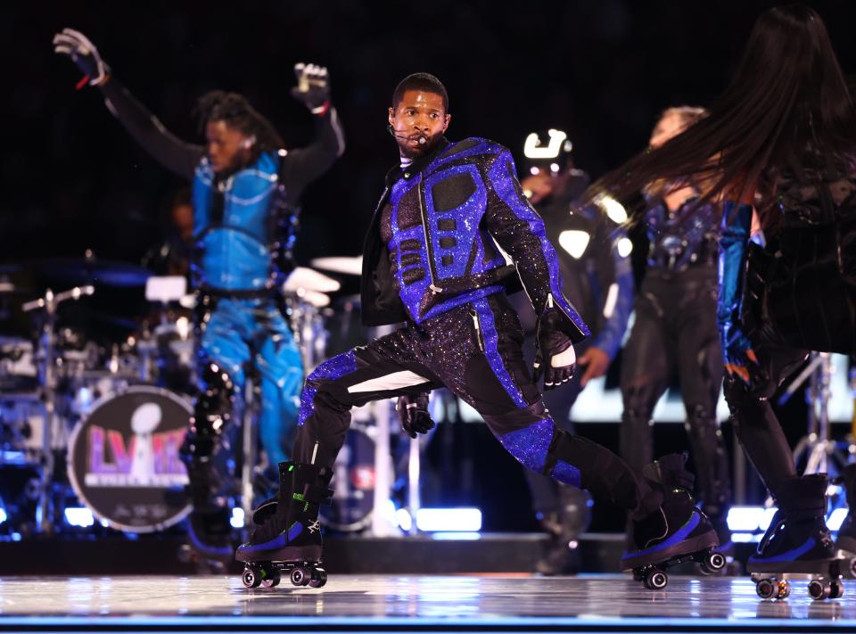 Usher roller skates and sings during the halftime of Super Bowl LVIII between the Kansas City Chiefs and the San Francisco 49ers at Allegiant Stadium.