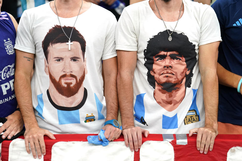 Close up of a set of twins wearing shirts featuring Argentina's Lionel Messi and Diego Maradona before the FIFA World Cup Semi-Final match at the Lusail Stadium in Lusail, Qatar. Picture date: Tuesday December 13, 2022. (Photo by Mike Egerton/PA Images via Getty Images)