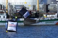 Enviromental activist groups including Greenpeace protest against "greenwashing" advertisements in Rotterdam