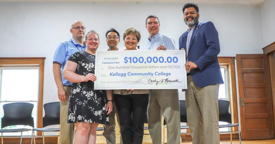 From left are Scott Cubberly, Caroline Hurteau. Elmer Lee, Carolyn Bloodworth, Greg Moore and interim Kellogg Community College President Paul R. Watson II during a ceremonial presentation of a $100,000 check from the Consumers Energy Foundation to KCC May 21, 2022.