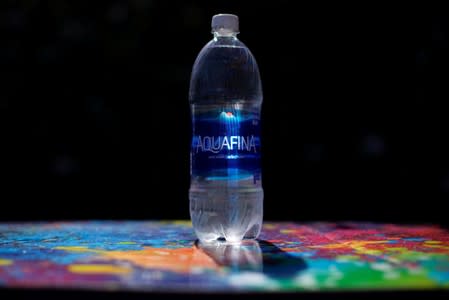 A bottle of Aquafina drinking water is shown in this photo illustration