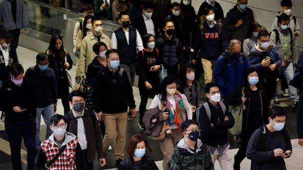 PHOTO: People wear face masks in the MTR station, a day before government gets rid of the mask rule in Hong Kong, Feb. 28, 2023. (Tyrone Siu/Reuters)