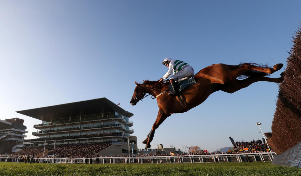 Baron Alco and Jamie Moore jump the last on their way to winning the BetVictor Gold Cup Handicap Chase