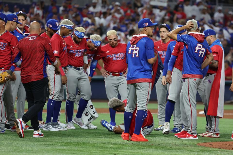 Edwin Diaz #39 of Team Puerto Rico lies hurt on the field after celebrating a 5-2 win against Team Dominican Republic during their World Baseball Classic Pool D game at loanDepot park on March 15, 2023 in Miami, Florida.