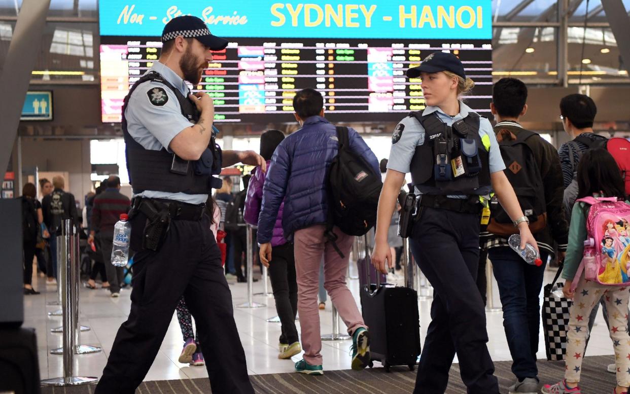 Police patrol Sydney Airport after the 'terror plot' was foiled - AFP