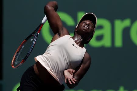 Mar 29, 2018; Key Biscayne, FL, USA; Sloane Stephens of the United States serves against Victoria Azarenka of Belarus (not pictured) in a women's singles semi-final of the Miami Open at Tennis Center at Crandon Park. Mandatory Credit: Geoff Burke-USA TODAY Sports