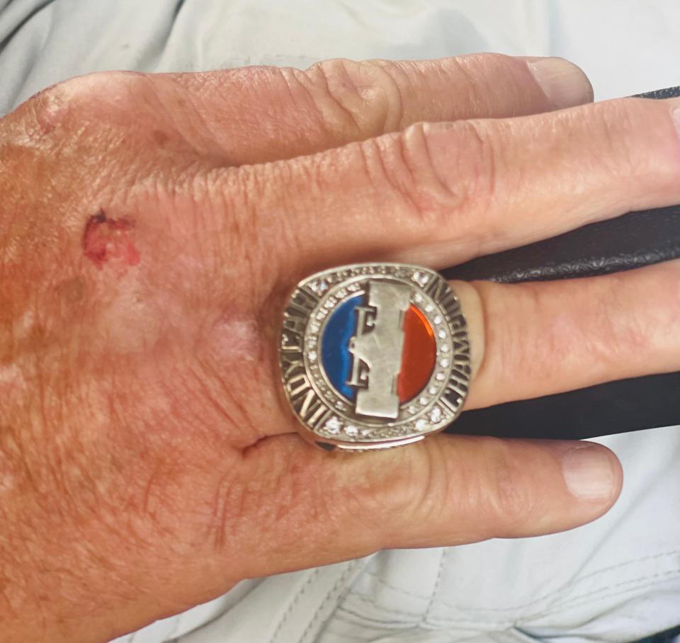 Dennis Weaks "Wadd" wears an IndyCar championship ring as he watches the race Sunday outside Scott Dixon's motorhome. Weaks is Dixon's driver.