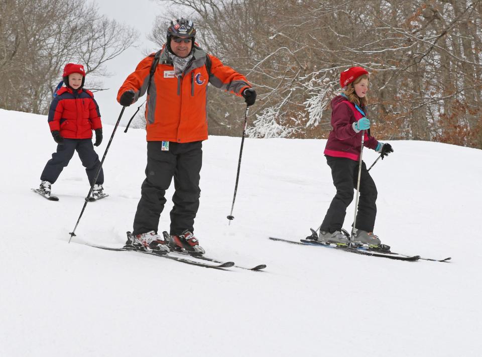 Brian Zahm, an instructor at Yawgoo Valley Ski Area, and his students head down the slope in 2019.