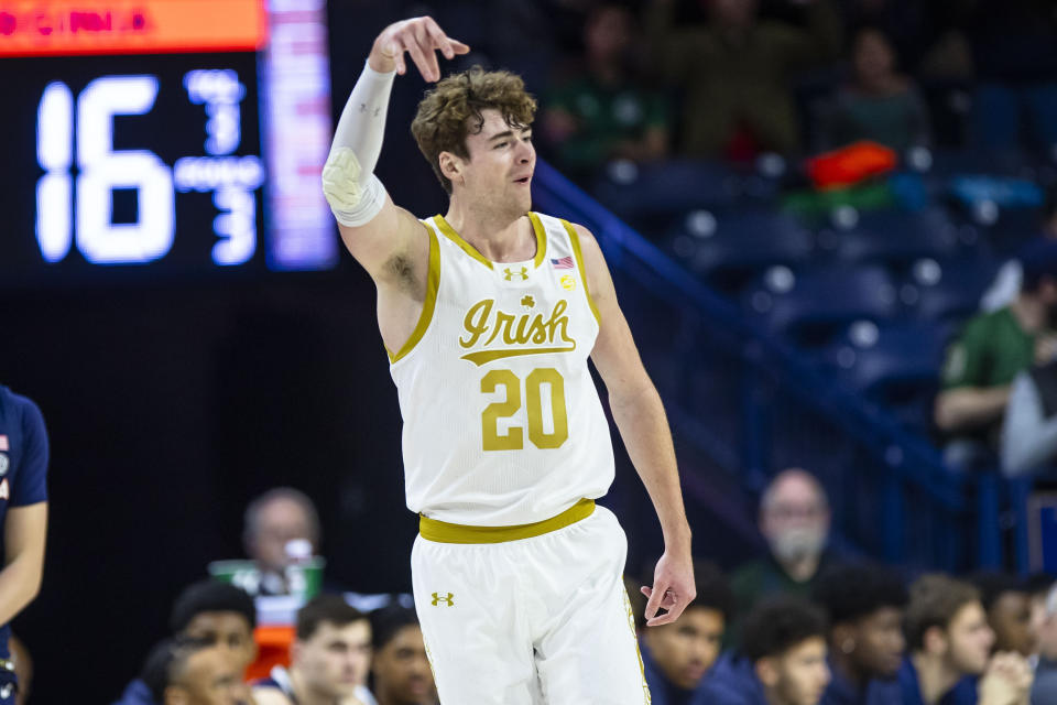 Notre Dame's J.R. Konieczny (20) celebrates a 3-point shot during the first half of an NCAA college basketball game against Virginia, Saturday, Dec. 30, 2023, in South Bend, Ind. (AP Photo/Michael Caterina)