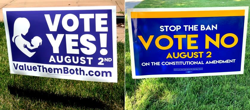 LEFT: In this photo from Friday, July 8, 2022, a sign in a yard in Olathe, Kansas, promotes a proposed amendment to the Kansas Constitution to allow legislators to further restrict or ban abortion. RIGHT: In this photo from Thursday, July 14, 2022, a sign in a yard in Merriam, Kansas, urges voters to oppose a proposed amendment to the Kansas Constitution to allow legislators to further restrict or ban abortion.