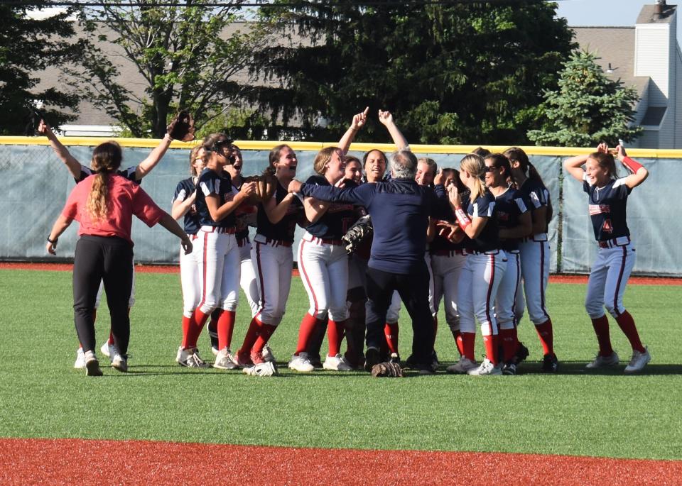 The New Hartford Spartans celebrate after the final out of their 6-3 Section III Class A championship win over Auburn at Onondaga Community College Thursday, June 2, 2022.