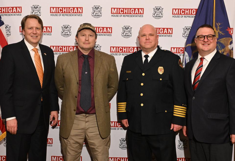 State Rep. Will Bruck, center left, today welcomed Bedford Fire Chief Bob Vanklingeren, center right, to the state Capitol for the governor’s annual State of the State address Wednesday, Jan. 24, 2024. They are shown with Senate Republican Leader Aric Nesbitt, left, and House Republican Leader Matt Hall, right.