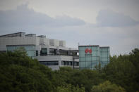 A Huawei sign is displayed on their premises in Reading, England, Tuesday, July 14, 2020. Britain's government on Tuesday backtracked on plans to give Chinese telecommunications company Huawei a limited role in the U.K.'s new high-speed mobile phone network in a decision with broad implications for relations between London and Beijing. (AP Photo/Matt Dunham)