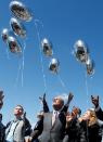 City, county and state officials release balloons in honor of the Florida school shooting victims during a prayer vigil