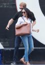 <p>Markle went casual in shirt, jeans and ballet pumps to the wheelchair tennis at the Invictus Games in Toronto, September 2017.</p>