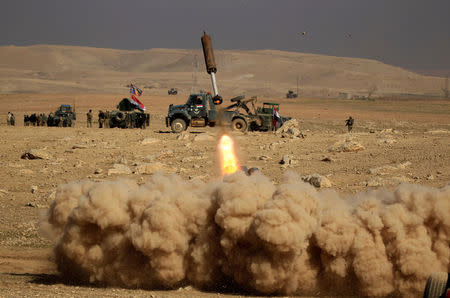 Members of the Iraqi rapid response forces fire a missile toward Islamic State militants during a battle in the south of Mosul, Iraq February 19, 2017. REUTERS/Zohra Bensemra