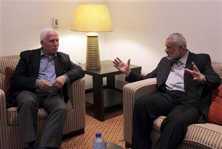 Head of the Hamas government Ismail Haniyeh (R) meets senior Fatah official Azzam Al-Ahmed a day after announcing a unity pact, in Gaza City April 24, 2014. REUTERS/Ahmed Sha'at/Gaza Prime Minister Office (PMO)/Handout via Reuters