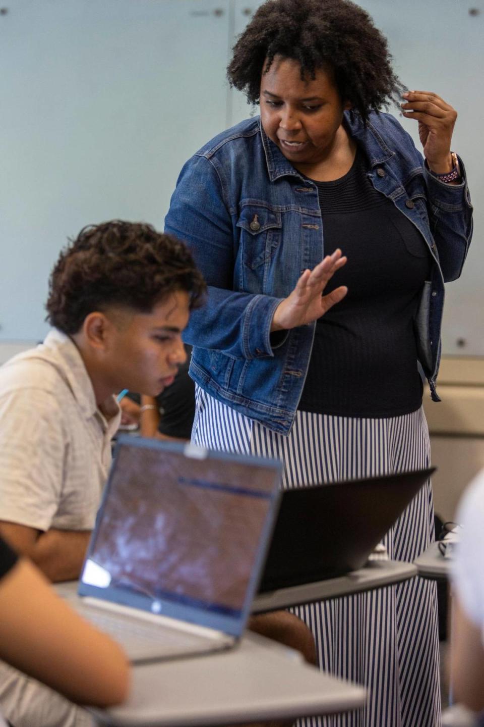 Professor Charity Watson, right, answers questions from a student during Calculus I class at FIU. FIU changed the way it teaches calculus, and managed to increase the pass rate of the class from about 55% to about 70%, opening up STEM careers to many more students. Miami, Florida, August 31, 2023 -